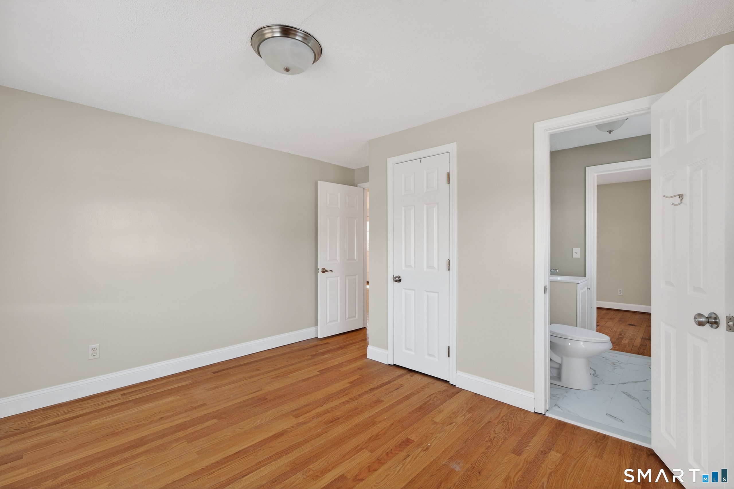 195 Middletown Avenue Wethersfield, CT 06109 - Photo 16 of 35 a view of a room with wooden floor and bathroom view