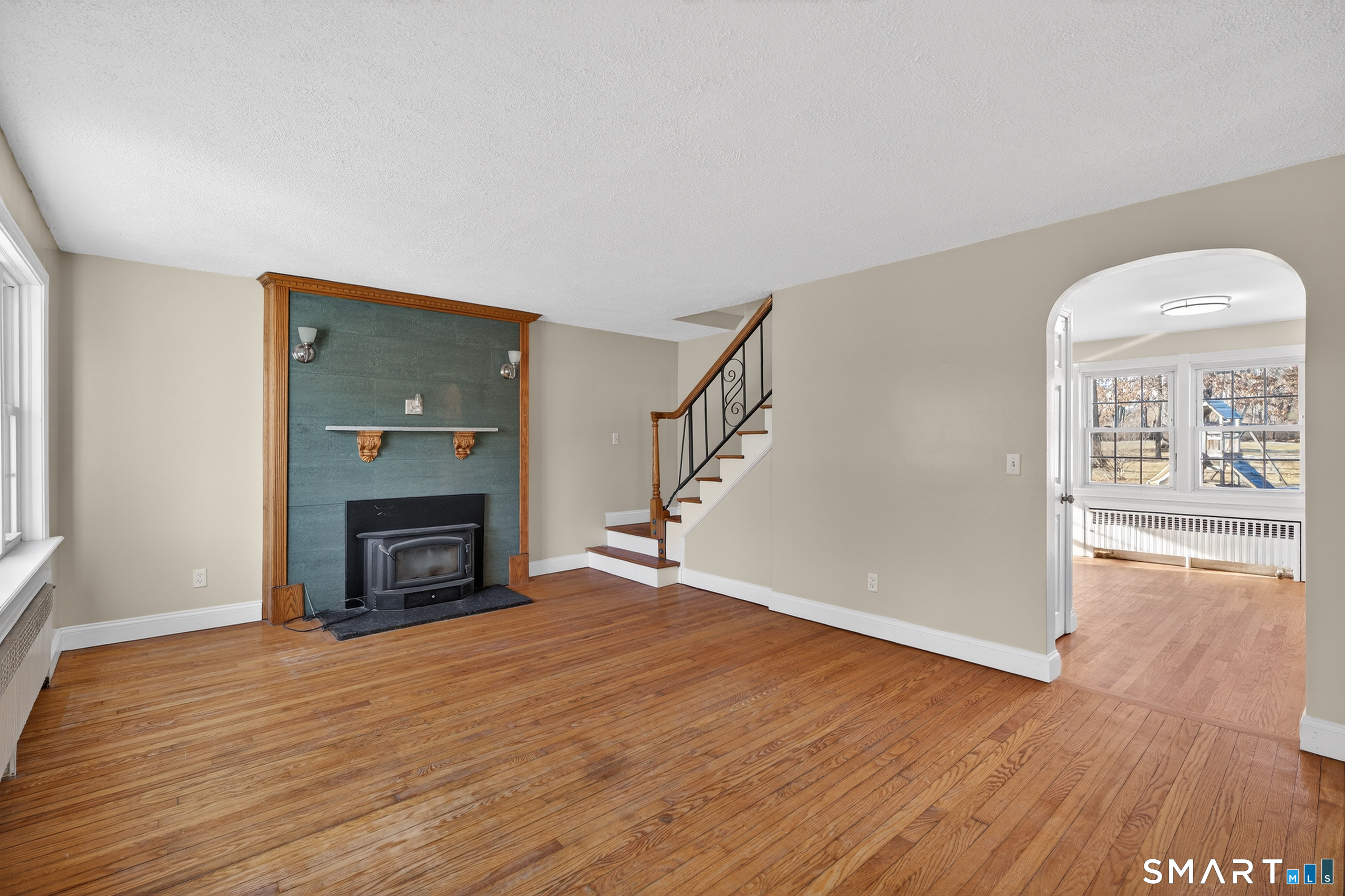 195 Middletown Avenue Wethersfield, CT 06109 - Photo 7 of 35 wooden floor fireplace and natural light in room