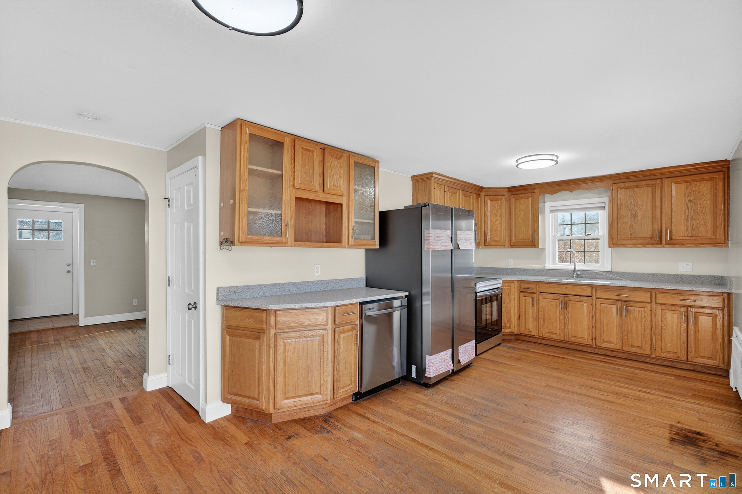 195 Middletown Avenue Wethersfield, CT 06109 - Photo 8 of 35 a kitchen with stainless steel appliances granite countertop a refrigerator a stove a sink and a wooden floors