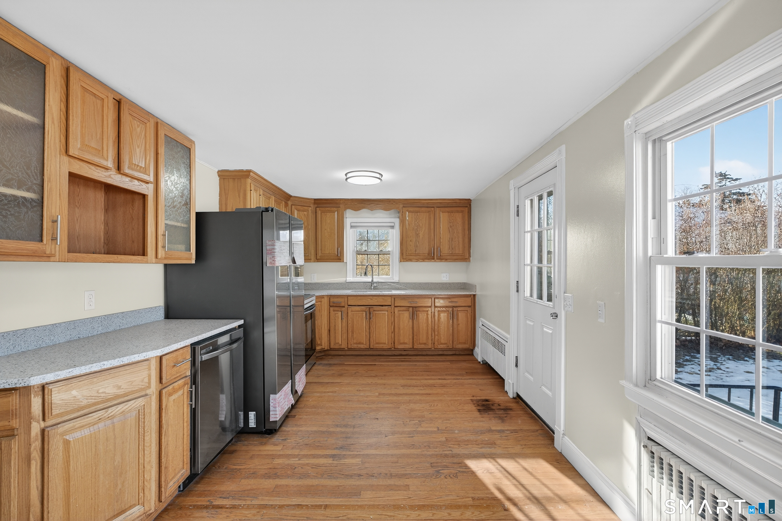 195 Middletown Avenue Wethersfield, CT 06109 - Photo 9 of 35 a kitchen with stainless steel appliances a refrigerator and a stove
