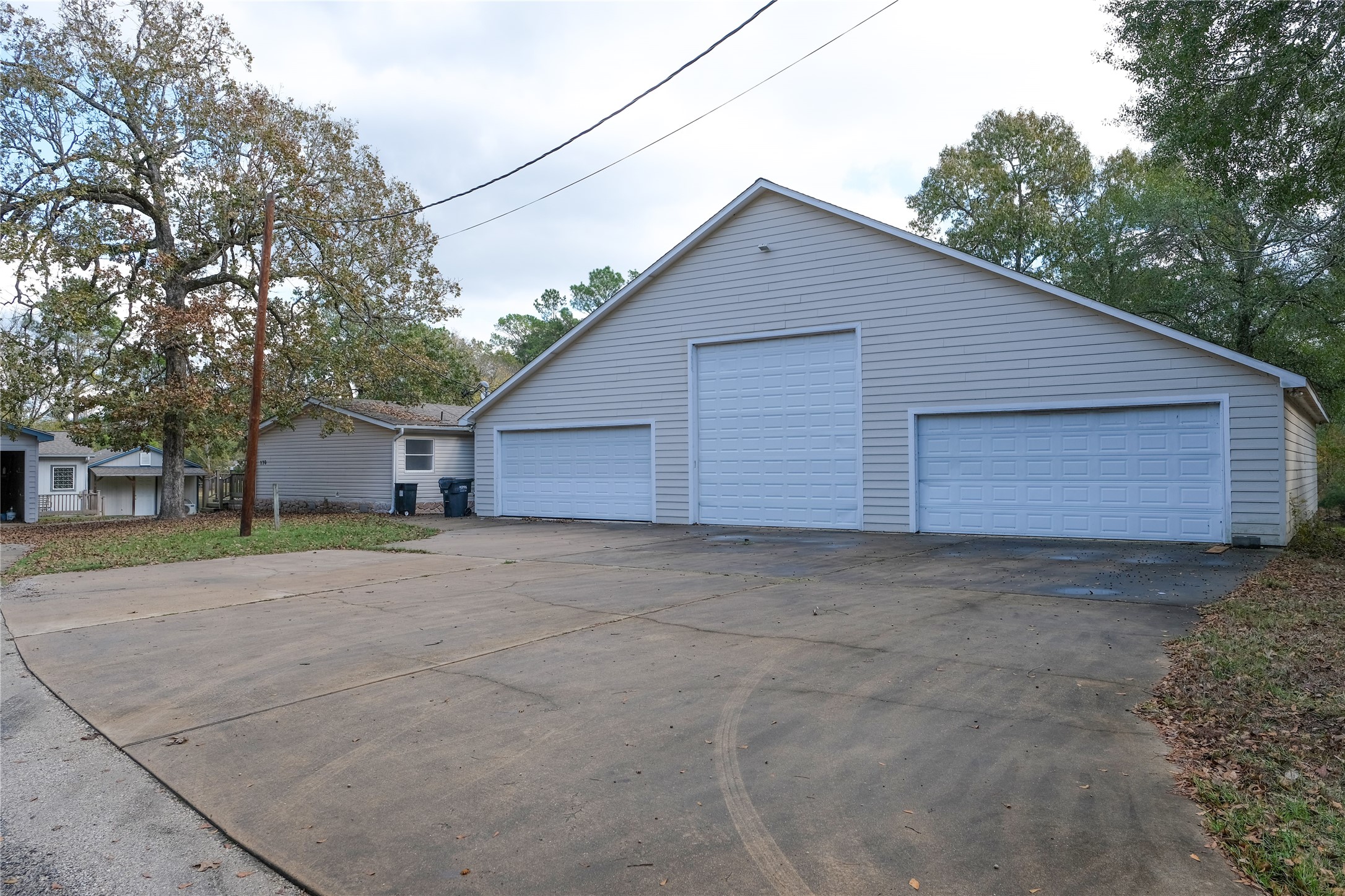 a view of a house with a yard and garage