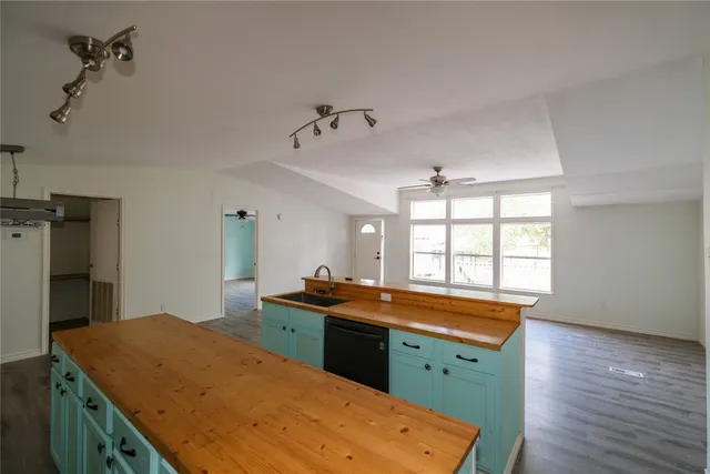 a view of a kitchen with a sink and dishwasher