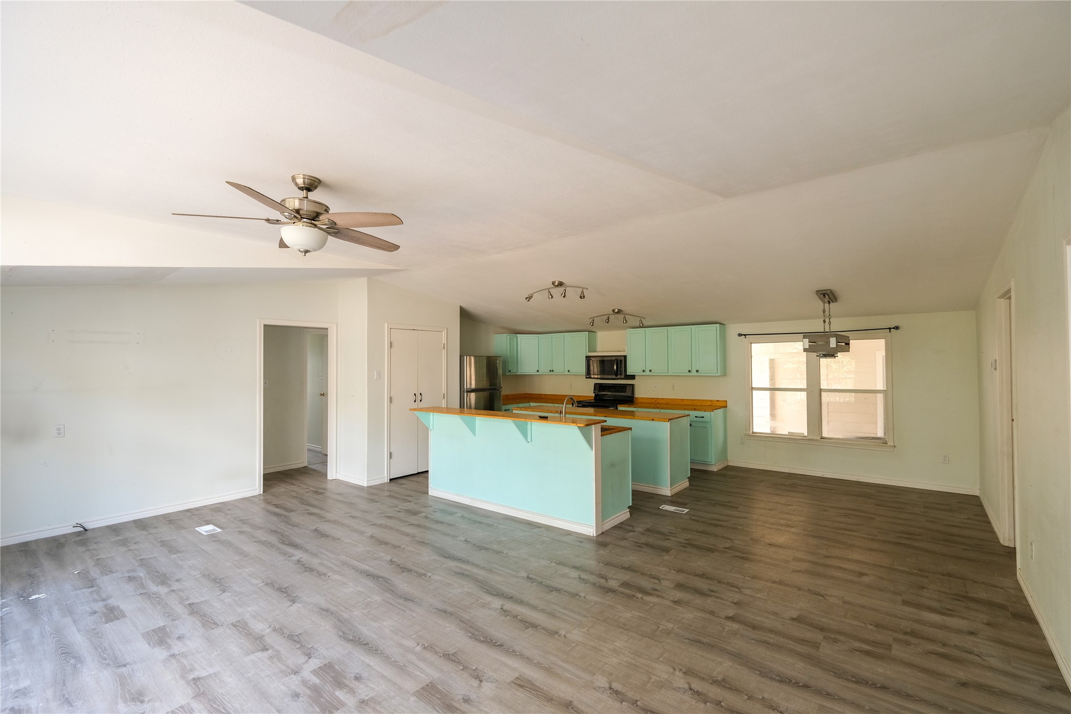 170 W Creek Trinity, TX 75862 - Photo 22 of 48 a kitchen with a refrigerator and a sink