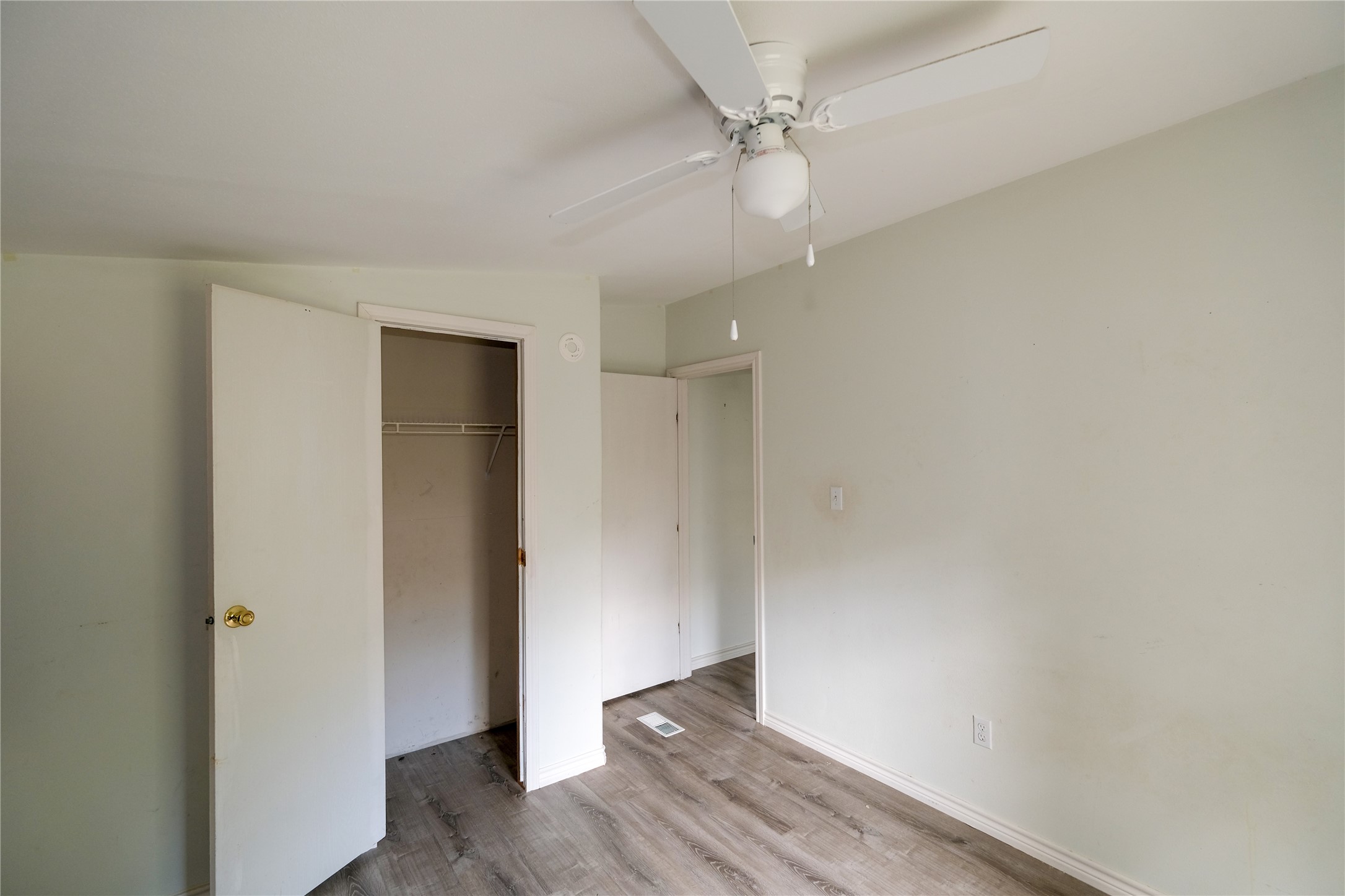 170 W Creek Trinity, TX 75862 - Photo 27 of 48 an empty room with closet and a ceiling fan