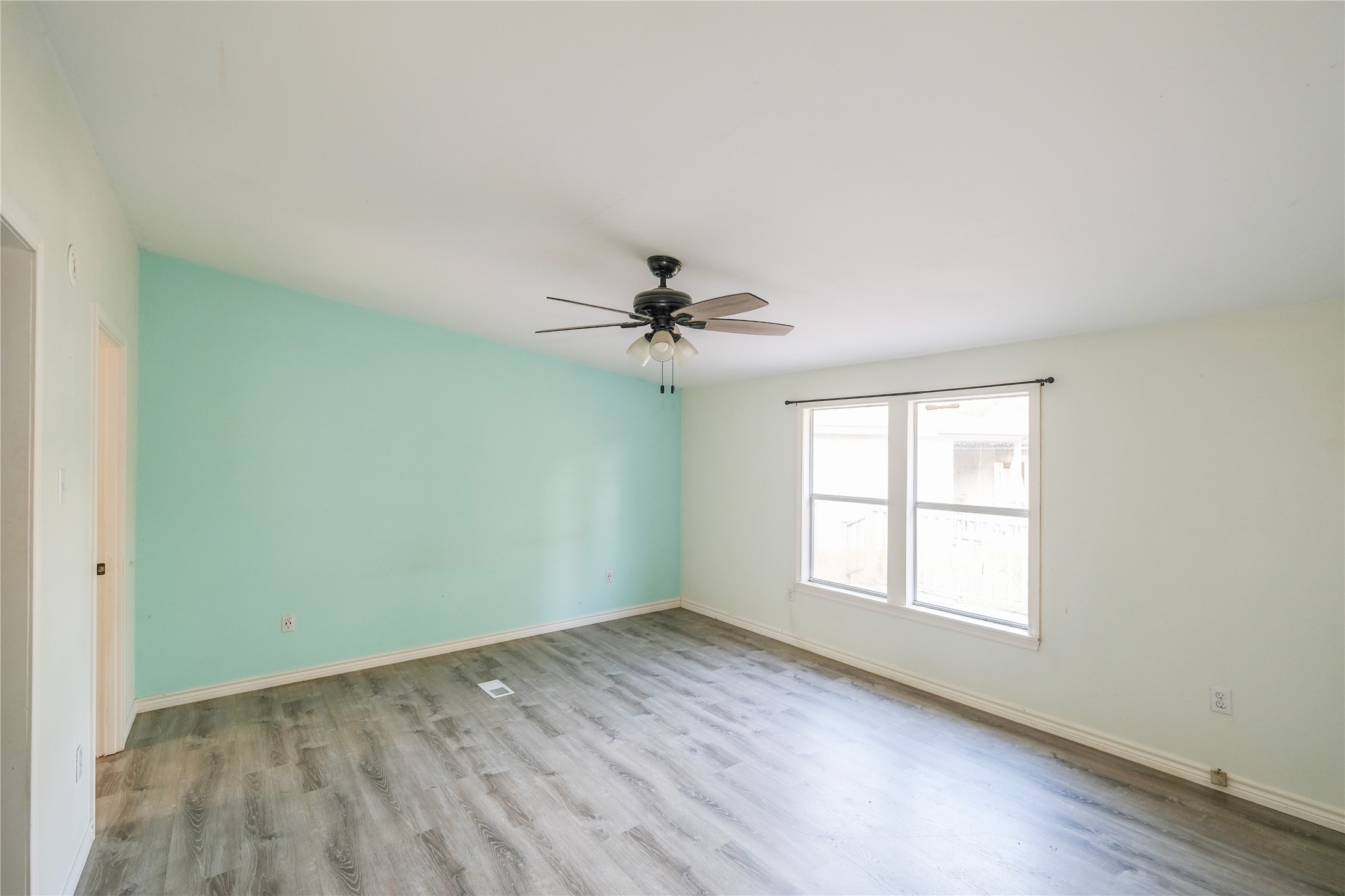 170 W Creek Trinity, TX 75862 - Photo 29 of 48 an empty room with windows and fan