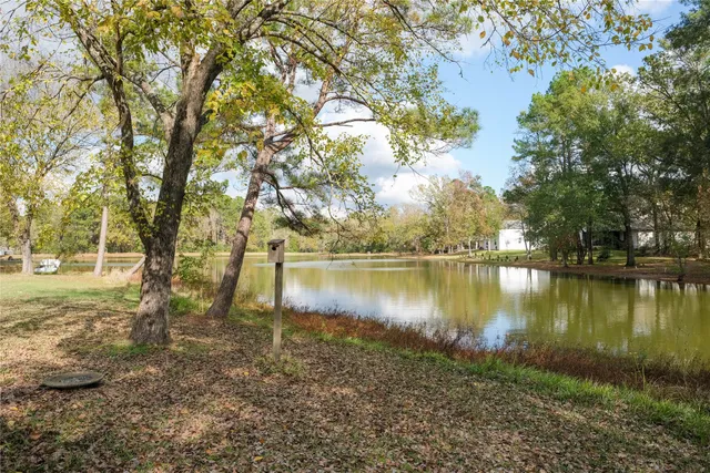 a view of a lake with a house in the background