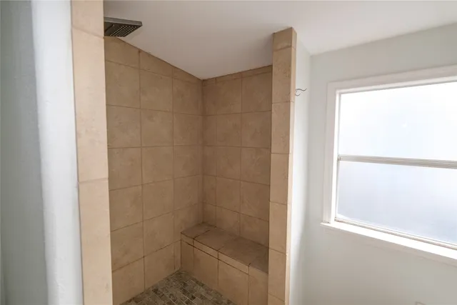 walk in closet with wooden floor