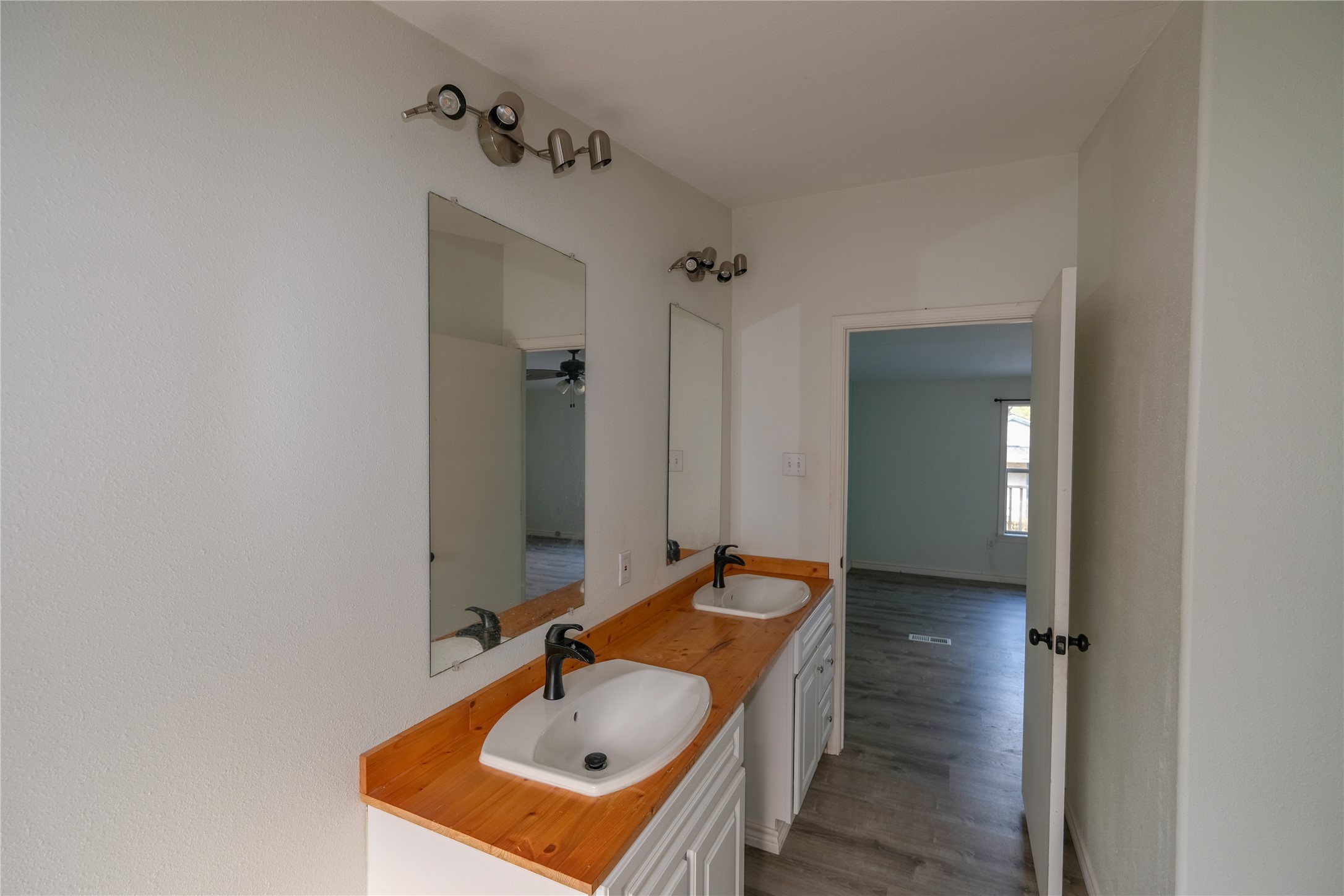 170 W Creek Trinity, TX 75862 - Photo 34 of 48 a bathroom with a sink and mirror