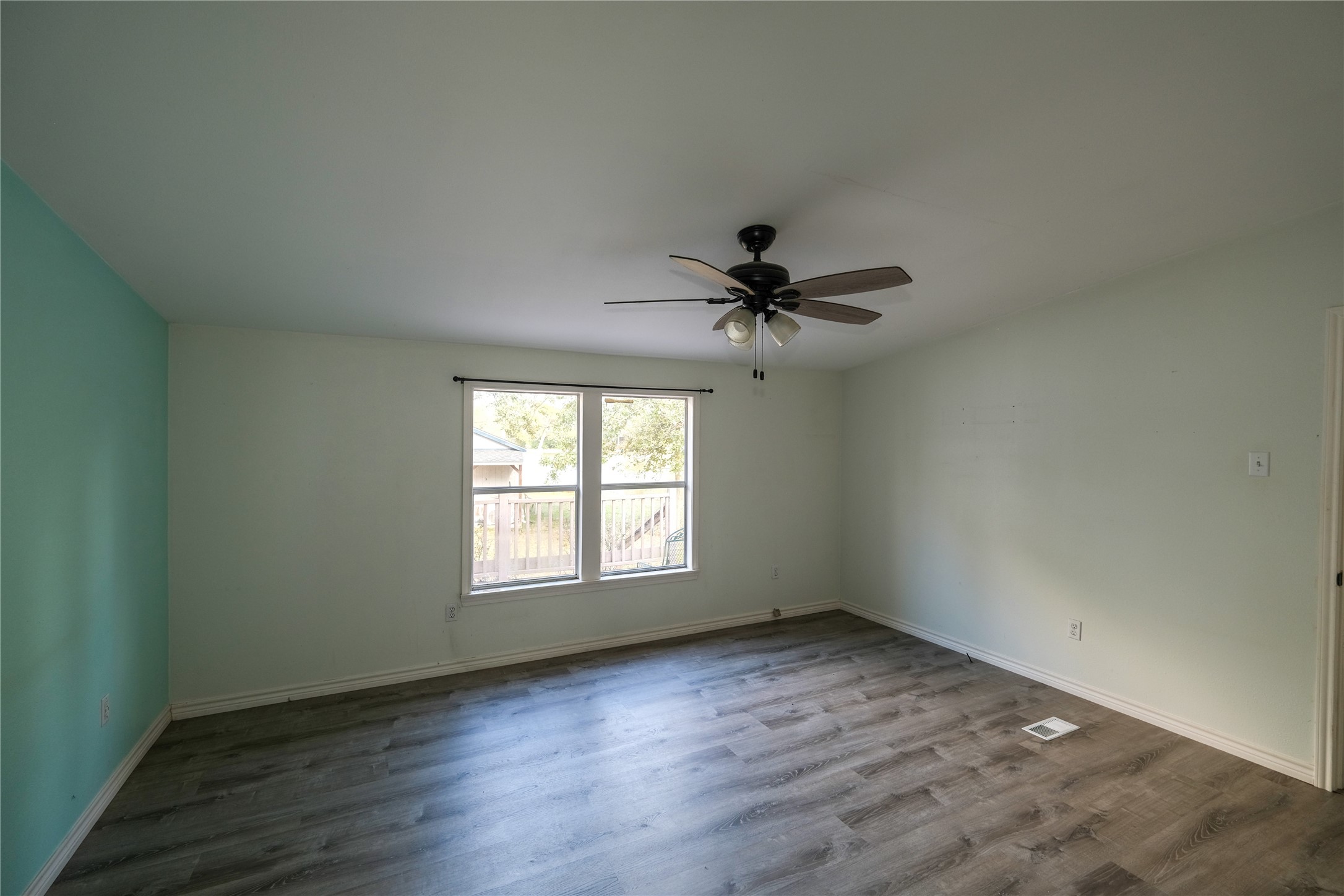 170 W Creek Trinity, TX 75862 - Photo 35 of 48 a view of empty room with wooden floor and fan