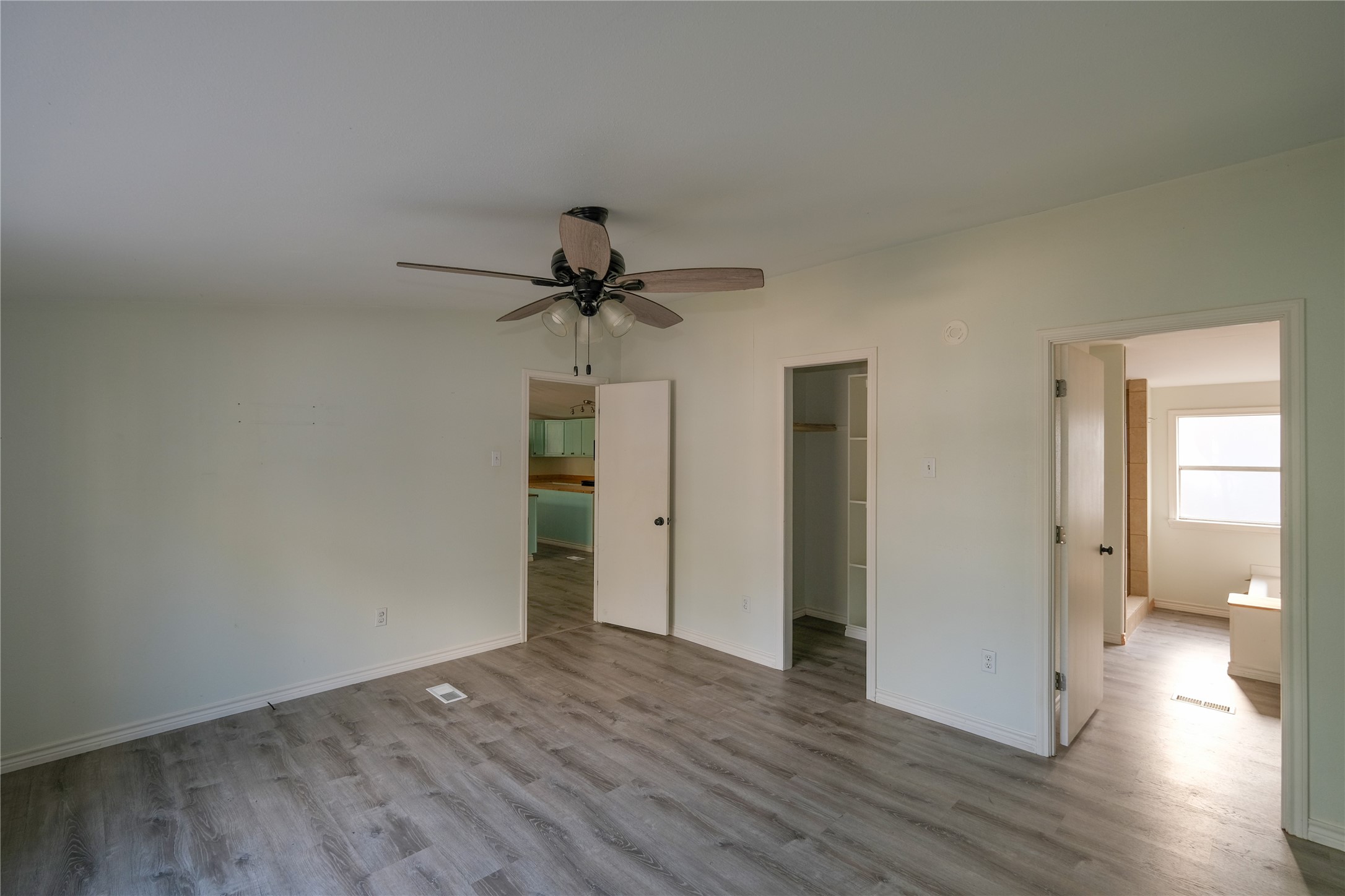170 W Creek Trinity, TX 75862 - Photo 36 of 48 a view of a room with wooden floor and ceiling fan