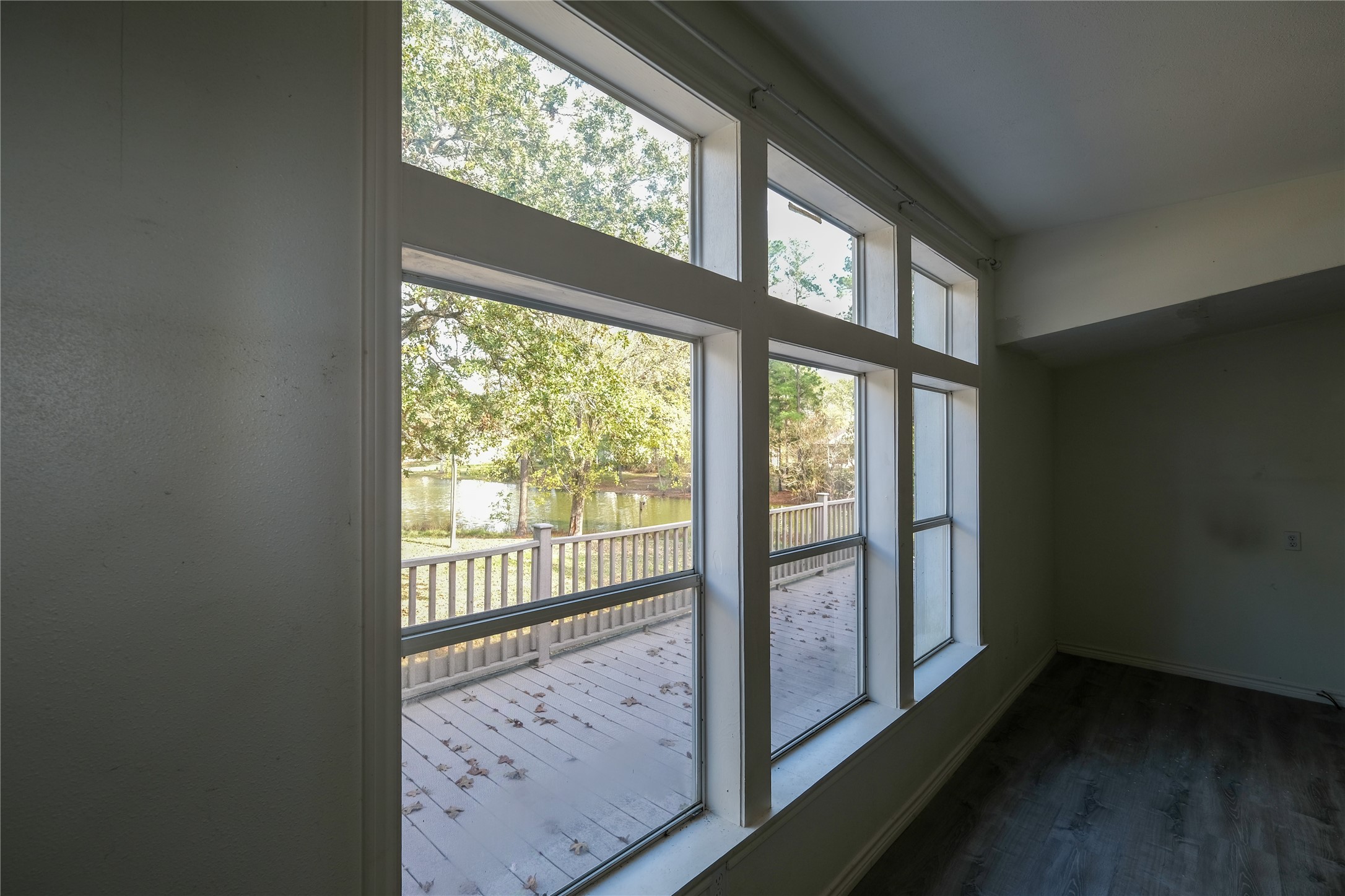 170 W Creek Trinity, TX 75862 - Photo 37 of 48 a view of an empty room with wooden floor and a window