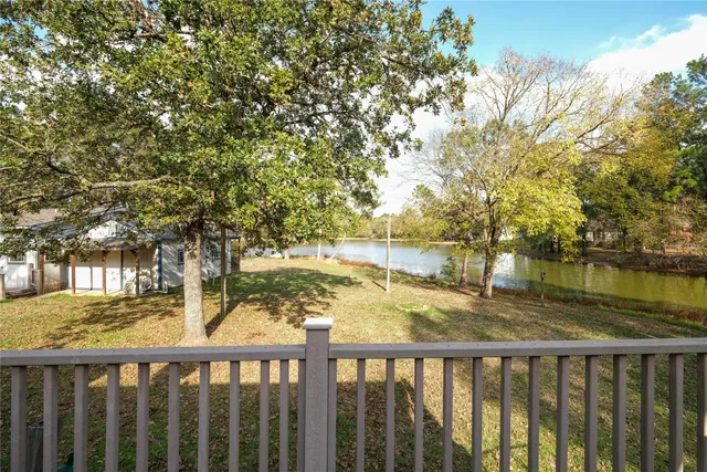 a view of a wooden fence and trees around