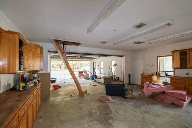 a living room with furniture a large window
