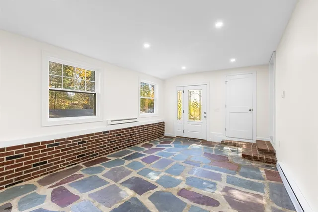 a view of an empty room with a sliding door