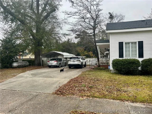 a view of a car parked in front of a house