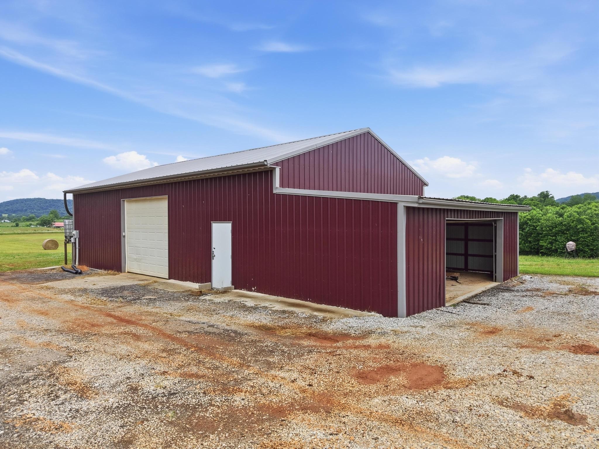 1050 Franks Ferry Road Sparta, TN 38583 - Photo 16 of 35 a front view of a house with a yard and garage