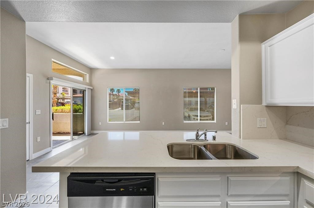 2305 West Horizon Ridge Parkway, Unit 1411 Henderson, NV 89052 - Photo 11 of 17 This bright kitchen features ample counter space, a double sink, and sleek appliances, perfect for everyday living.