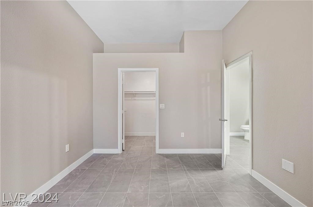 2305 West Horizon Ridge Parkway, Unit 1411 Henderson, NV 89052 - Photo 15 of 17 An inviting room features clean lines and a neutral palette, offering a serene personal retreat.