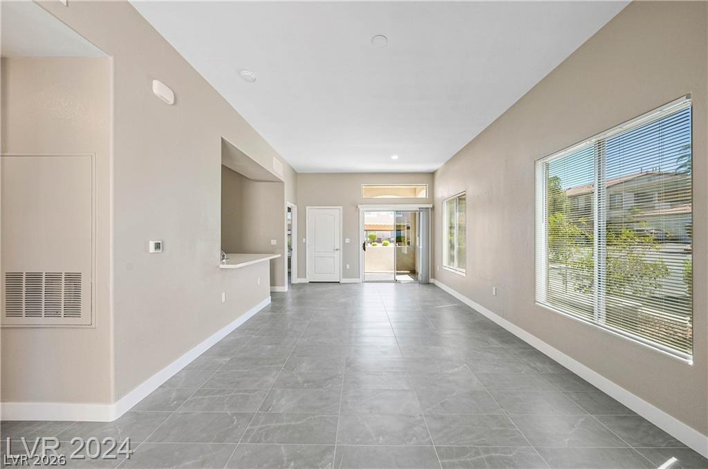 2305 West Horizon Ridge Parkway, Unit 1411 Henderson, NV 89052 - Photo 3 of 17 This bright, open space features sleek tile flooring, large windows, and a sliding glass door to outdoor living.