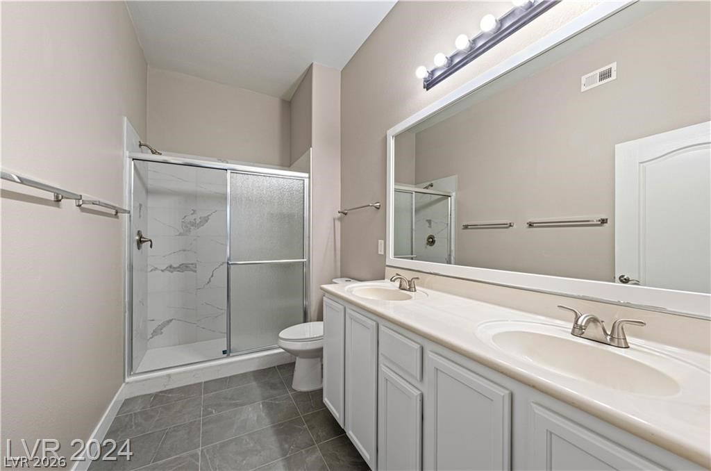 2305 West Horizon Ridge Parkway, Unit 1411 Henderson, NV 89052 - Photo 8 of 17 This bright bathroom features a spacious shower and a dual vanity with ample counter space.