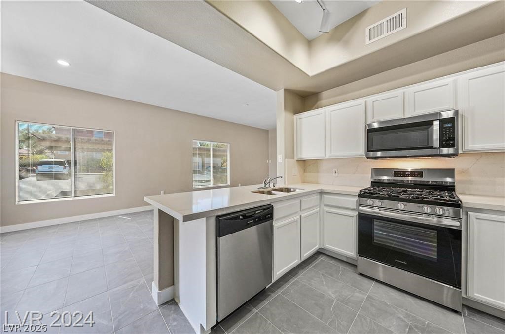 2305 West Horizon Ridge Parkway, Unit 1411 Henderson, NV 89052 - Photo 10 of 17 Bright and inviting kitchen with modern appliances and ample counter space.