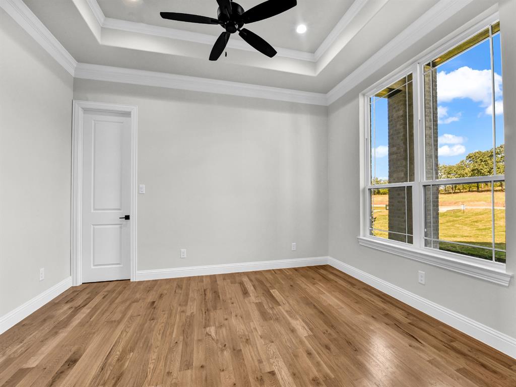 3009 Codigo Drive Weatherford, TX 76088 - Photo 13 of 40 a view of an empty room with a window and wooden floor