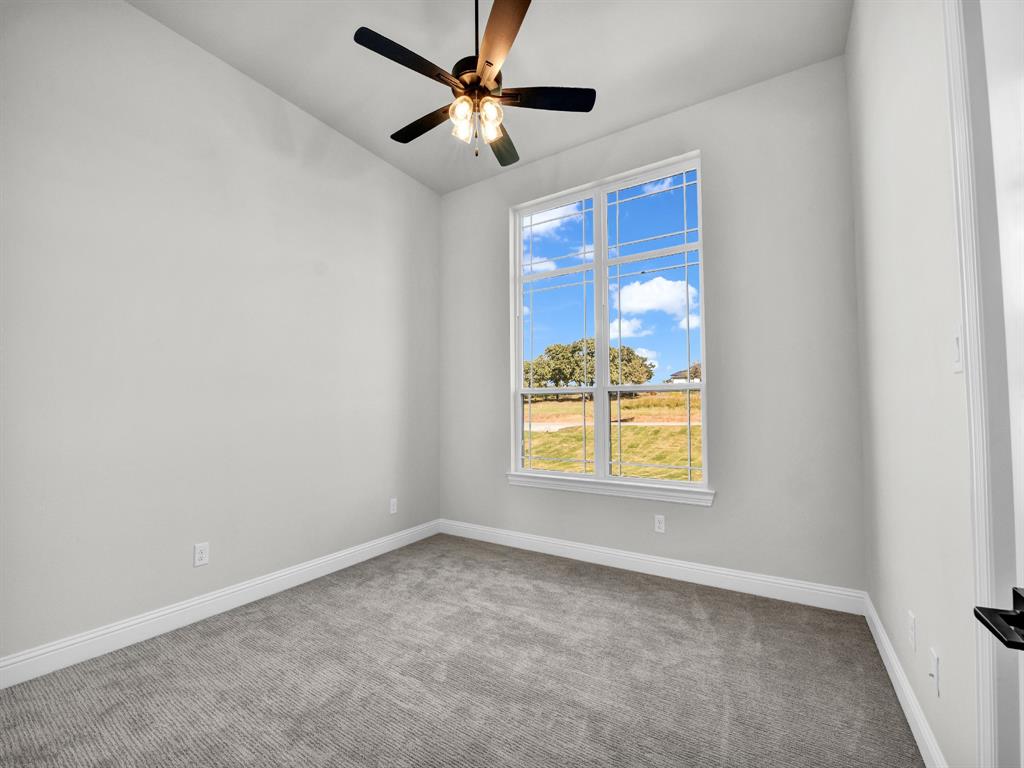 3009 Codigo Drive Weatherford, TX 76088 - Photo 30 of 40 an empty room with a window and a fan