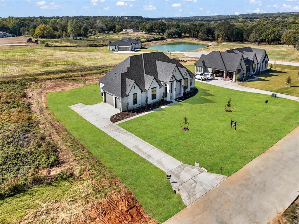 3009 Codigo Drive Weatherford, TX 76088 - Photo 6 of 40 a view of a swimming pool and lounge chair