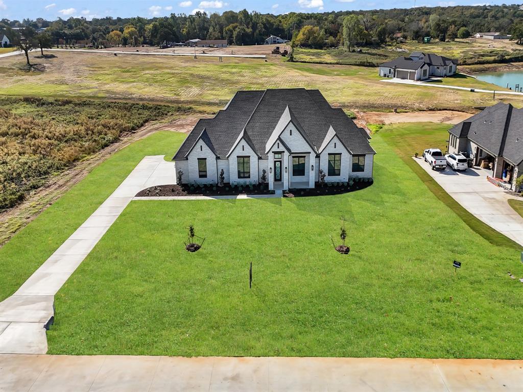 3009 Codigo Drive Weatherford, TX 76088 - Photo 7 of 40 a view of a house with garden