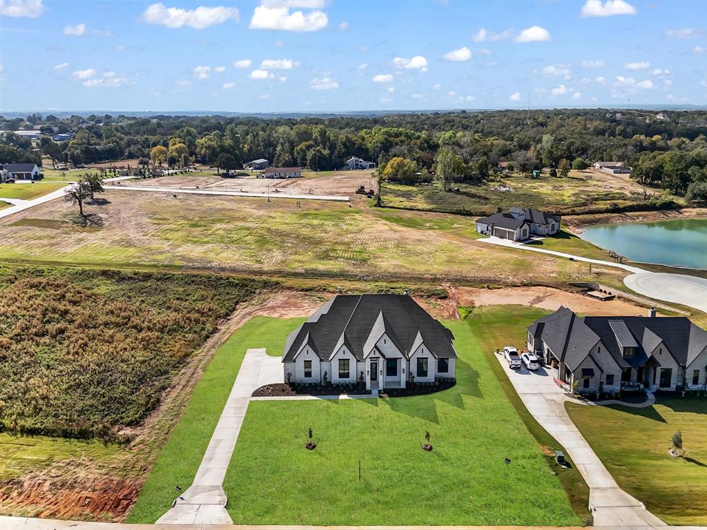 3009 Codigo Drive Weatherford, TX 76088 - Photo 8 of 40 a view of a swimming pool with a yard and outdoor seating