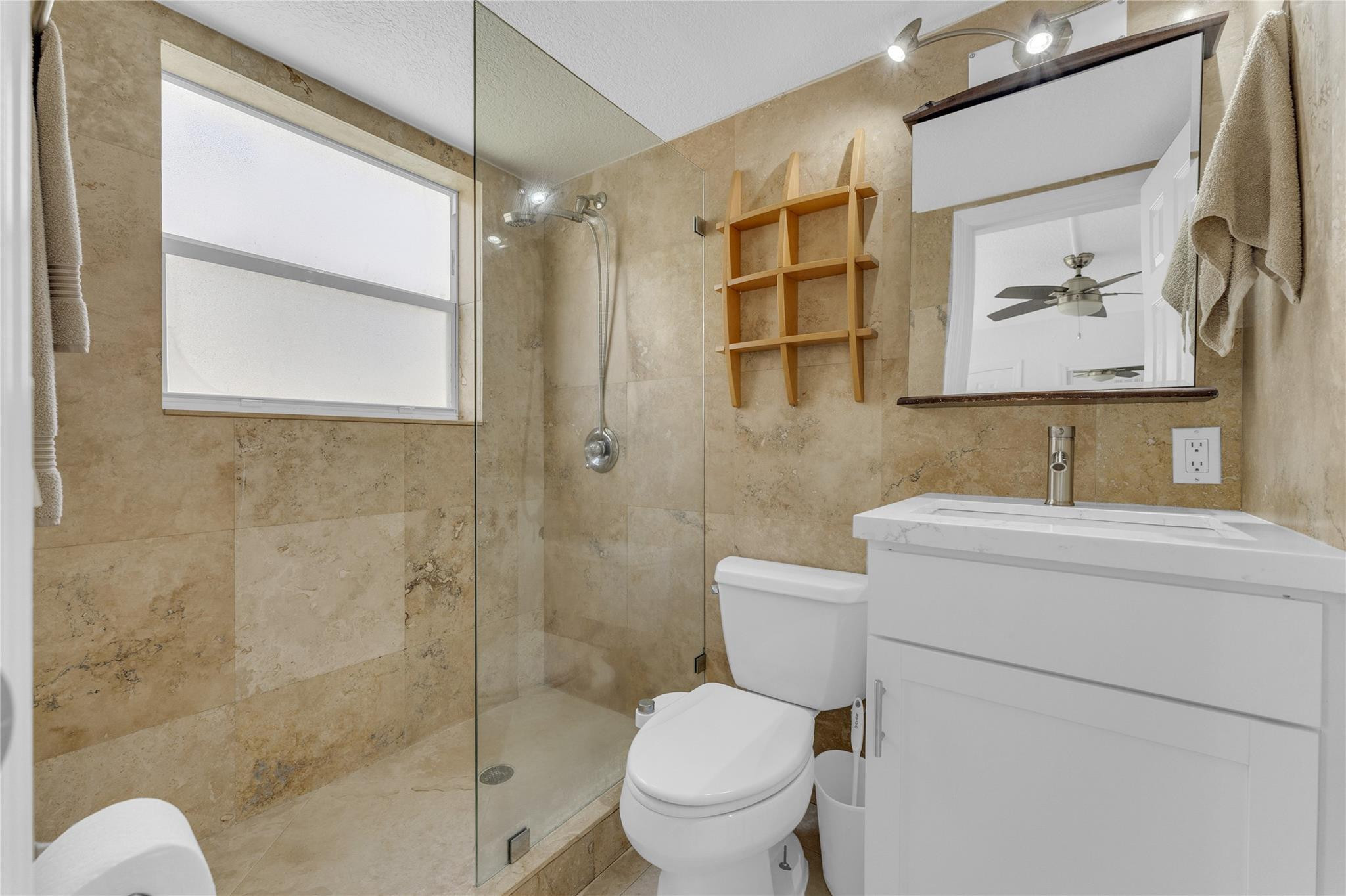 3225 Northeast 16th Street, Unit 10 Pompano Beach, FL 33062 - Photo 17 of 22 a bathroom with a toilet sink and shower