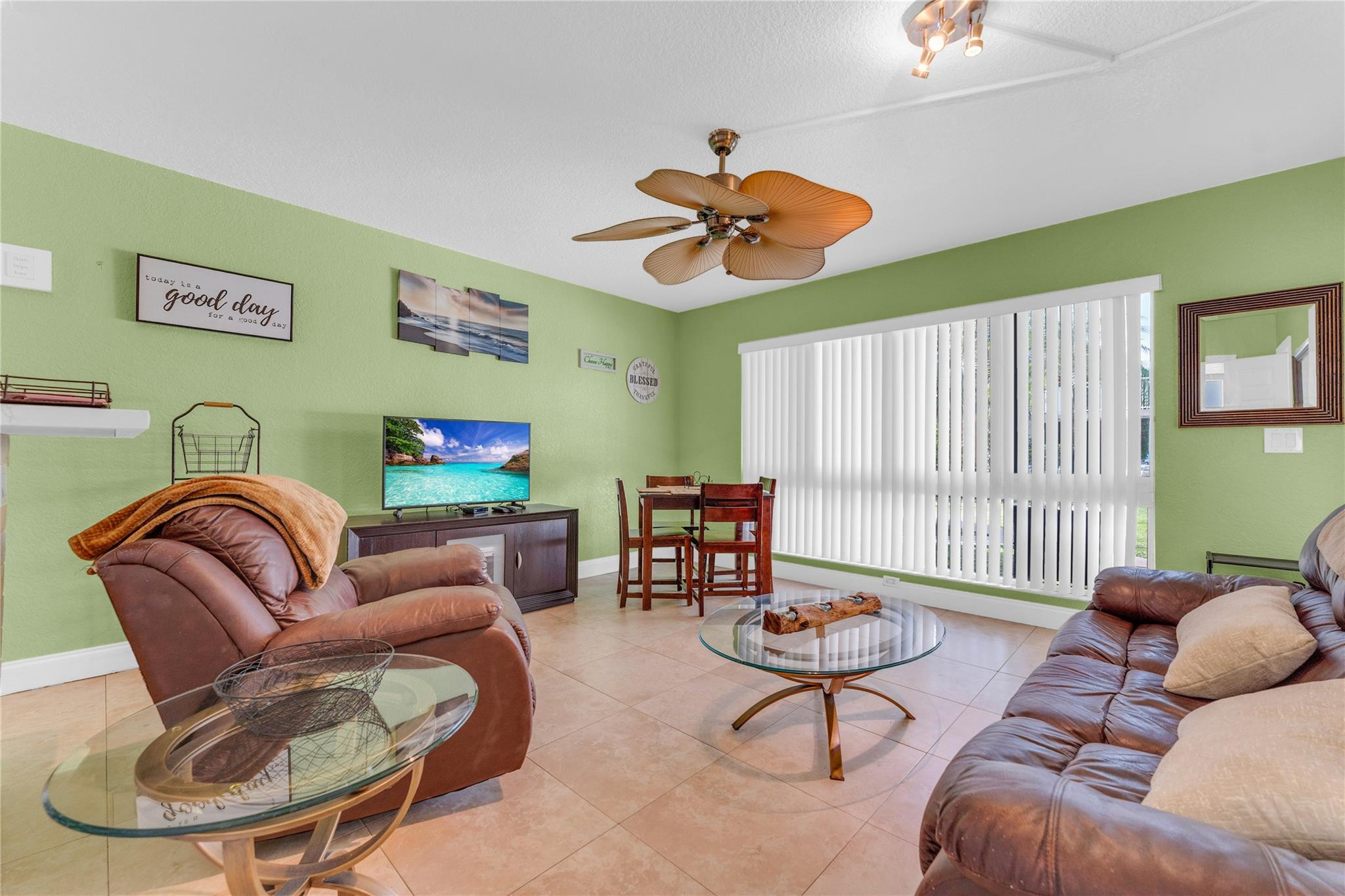 3225 Northeast 16th Street, Unit 10 Pompano Beach, FL 33062 - Photo 6 of 22 a living room with furniture a rug and a large window