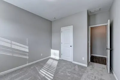 a view of room with window and entryway