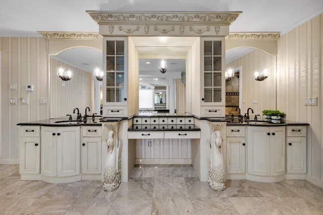 a spacious bedroom with a bed and a flat screen tv