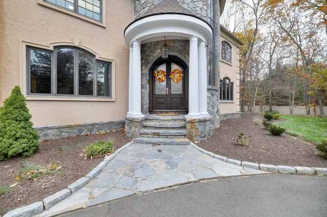 a front view of a house with garden