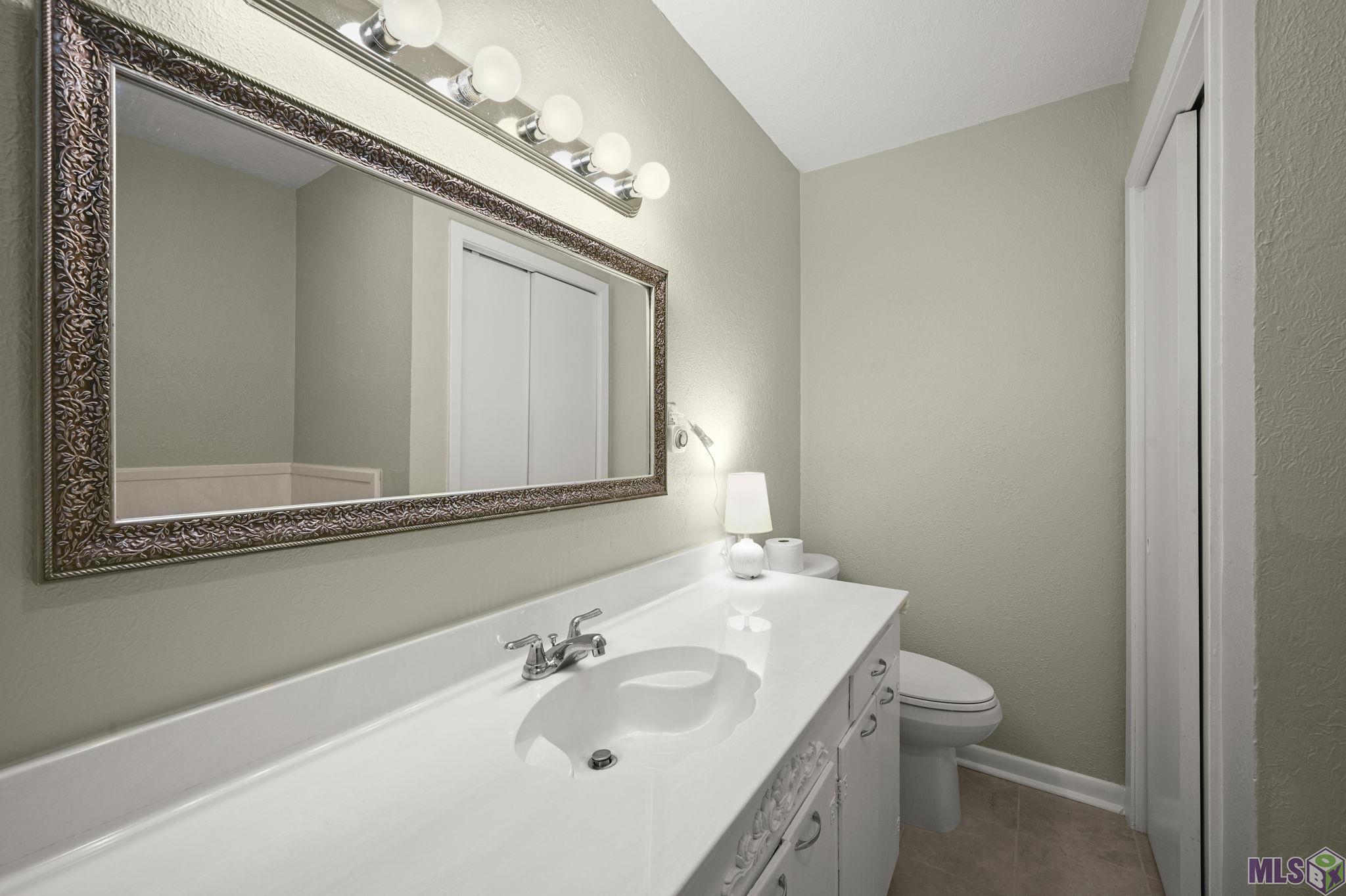 13034 Harold Road Gonzales, LA 70737 - Photo 14 of 20 PARTIAL VIEW OF GUEST FULL BATH