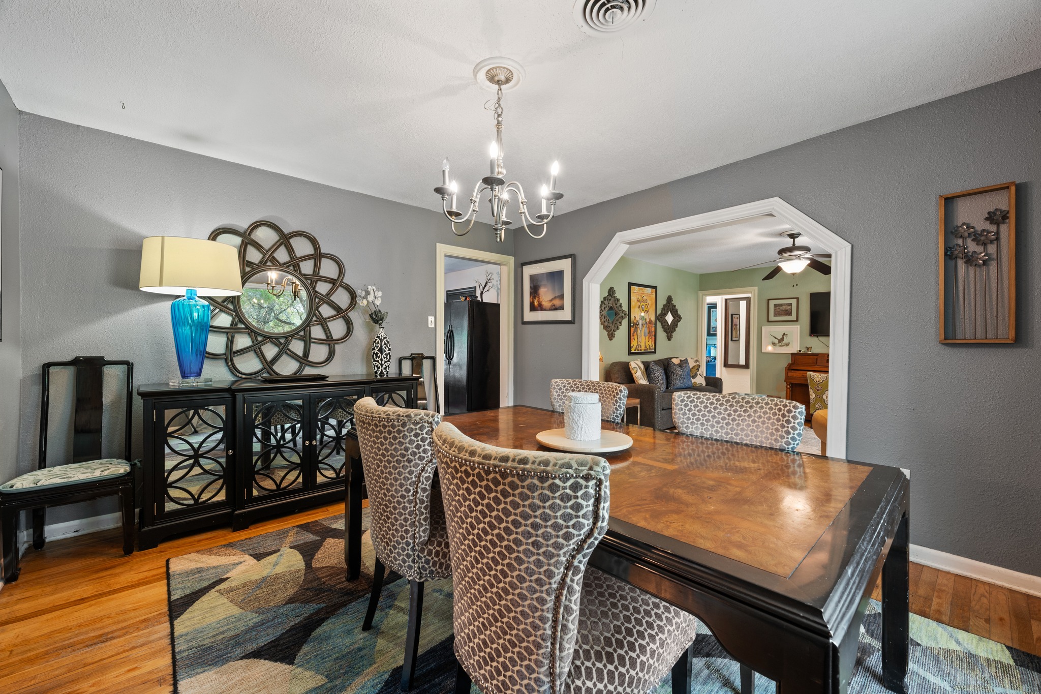 12932 Nutty Brown Road Austin, TX 78737 - Photo 22 of 40 Roadrunner - Open dining area seamlessly connected to the kitchen and living spaces.