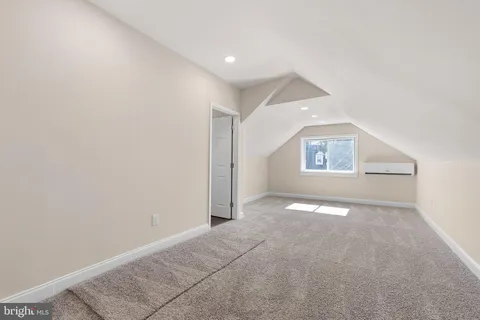 an empty room with windows and entrance