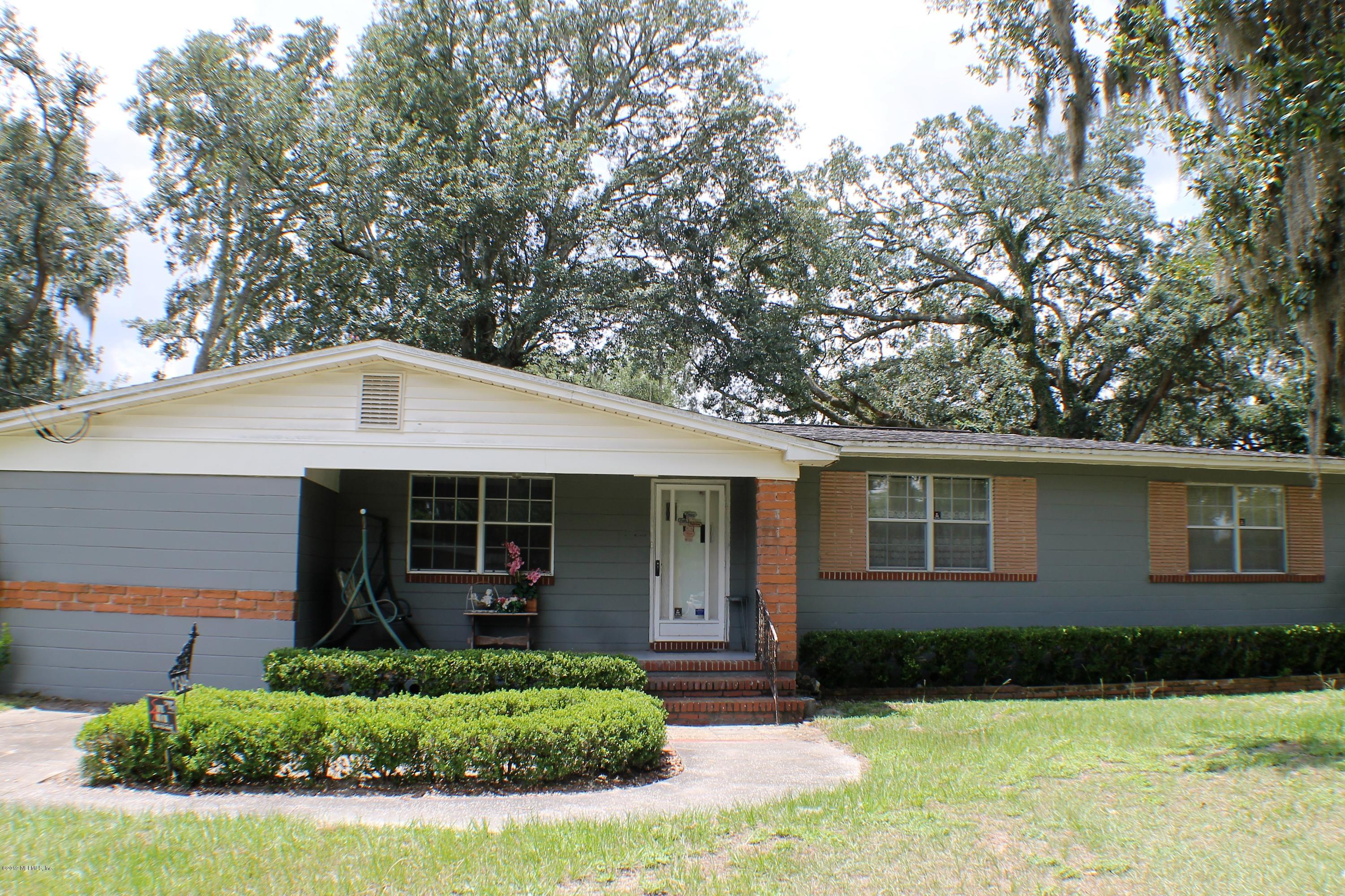 2346 Gayland Road Jacksonville, FL 32218 - Photo 1 of 14 a front view of a house with a yard and garage