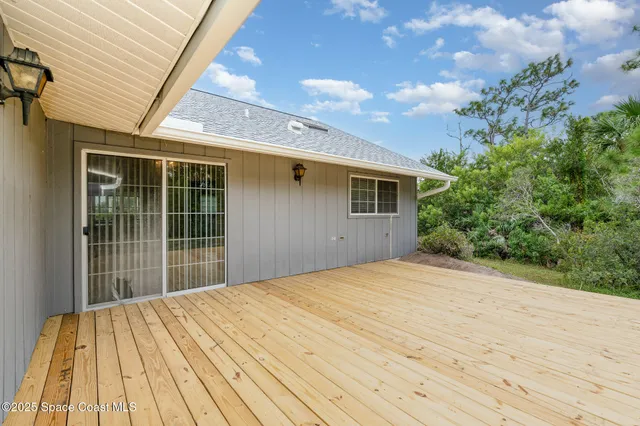 a view of backyard with green space