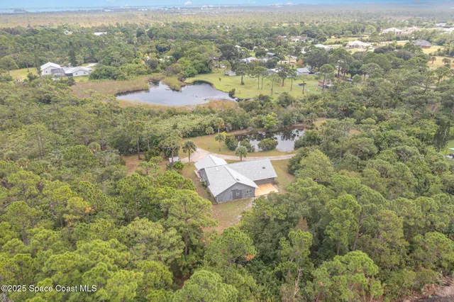 an aerial view of residential house with outdoor space