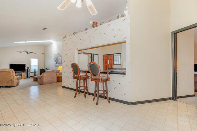 a view of livingroom with furniture and window