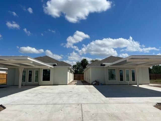 7006 North 56th Lane McAllen, TX 78573 - Photo 1 of 1 a view of a white house with a yard