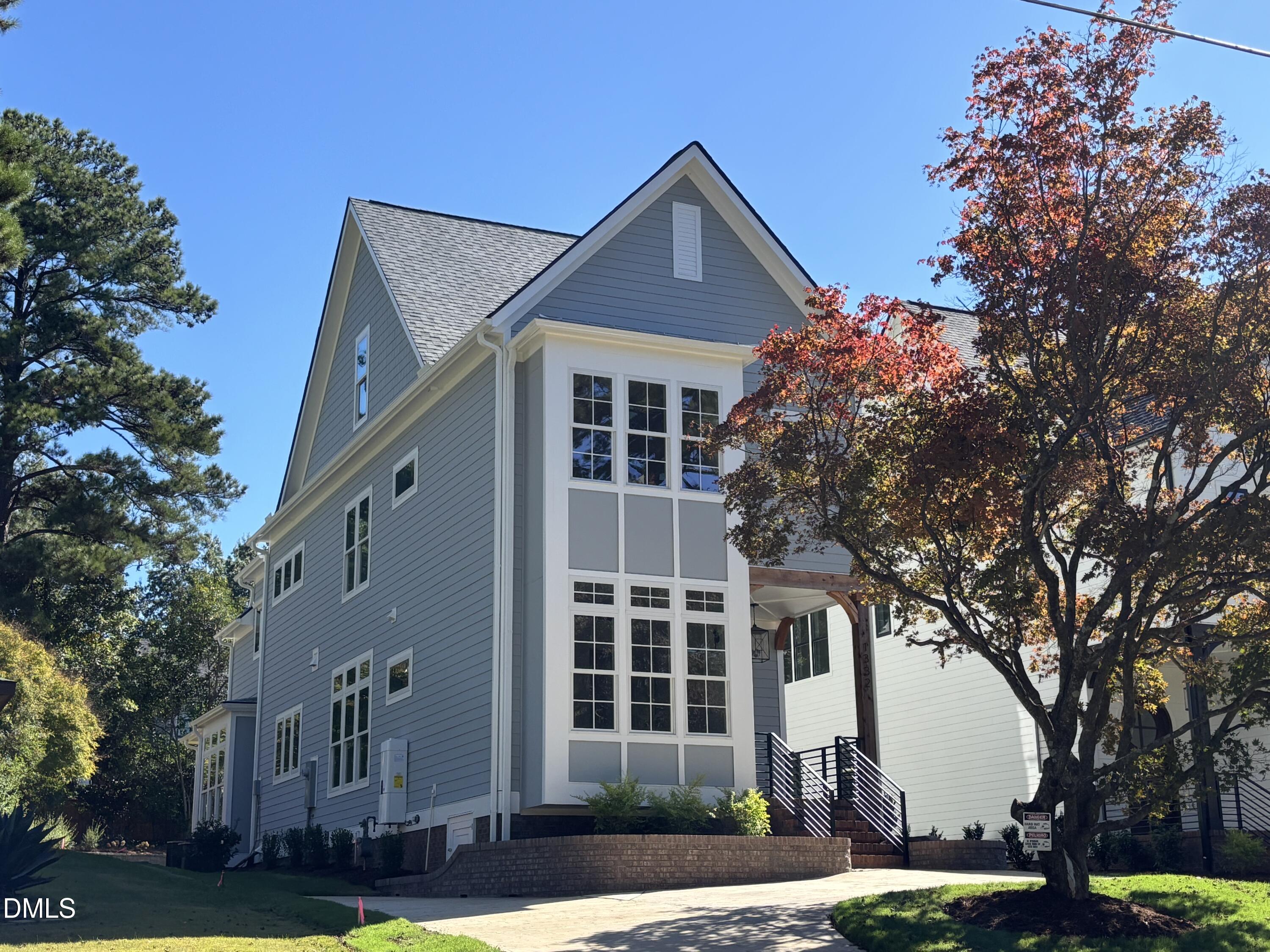 1332 Duplin Road Raleigh, NC 27607 - Photo 1 of 50 a front view of a house with a yard