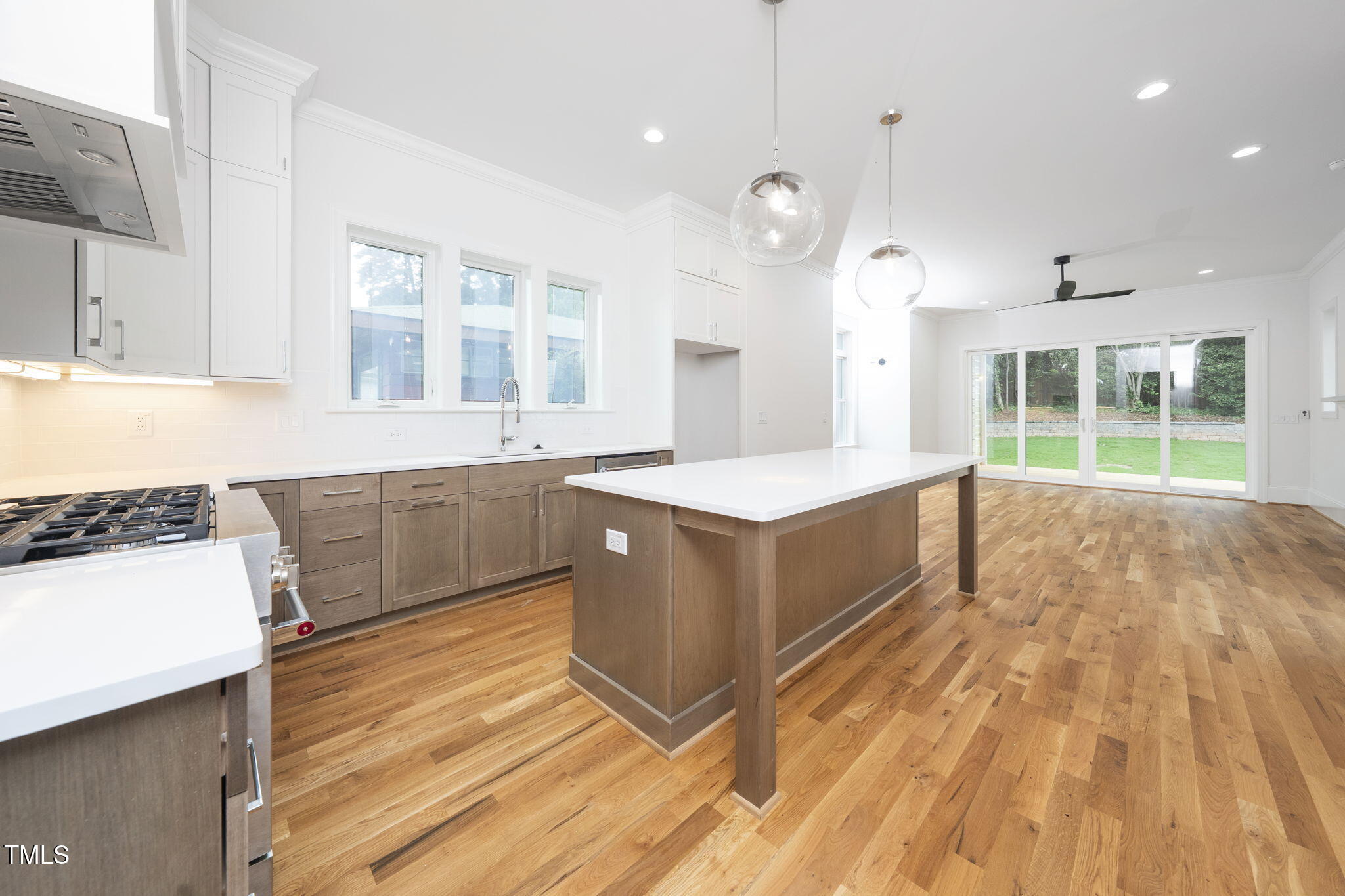 1332 Duplin Road Raleigh, NC 27607 - Photo 15 of 50 a large kitchen with kitchen island a sink stainless steel appliances and cabinets