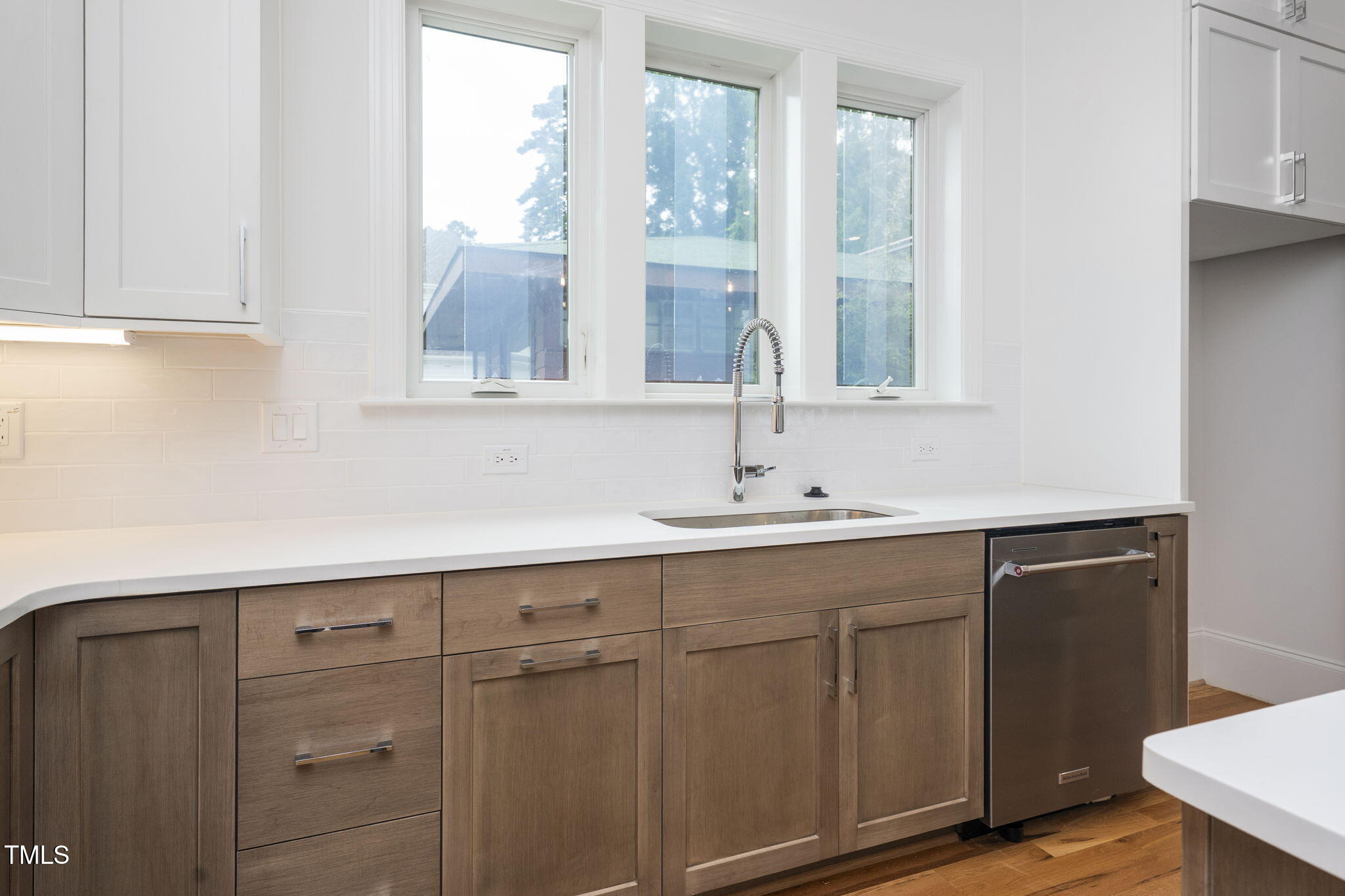 1332 Duplin Road Raleigh, NC 27607 - Photo 20 of 50 a sink with a window and cabinets