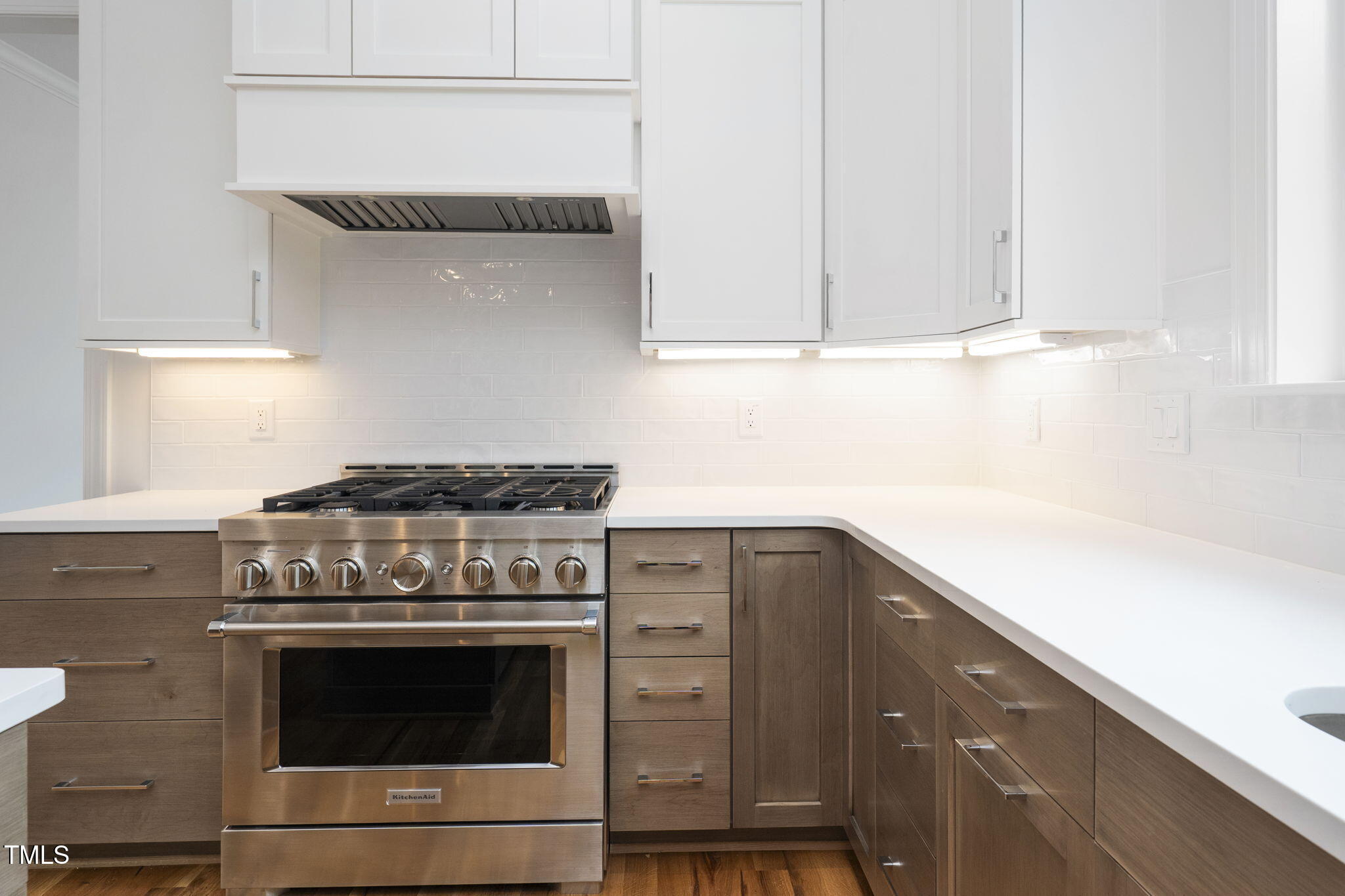 1332 Duplin Road Raleigh, NC 27607 - Photo 21 of 50 a kitchen with stainless steel appliances granite countertop white cabinets and a stove