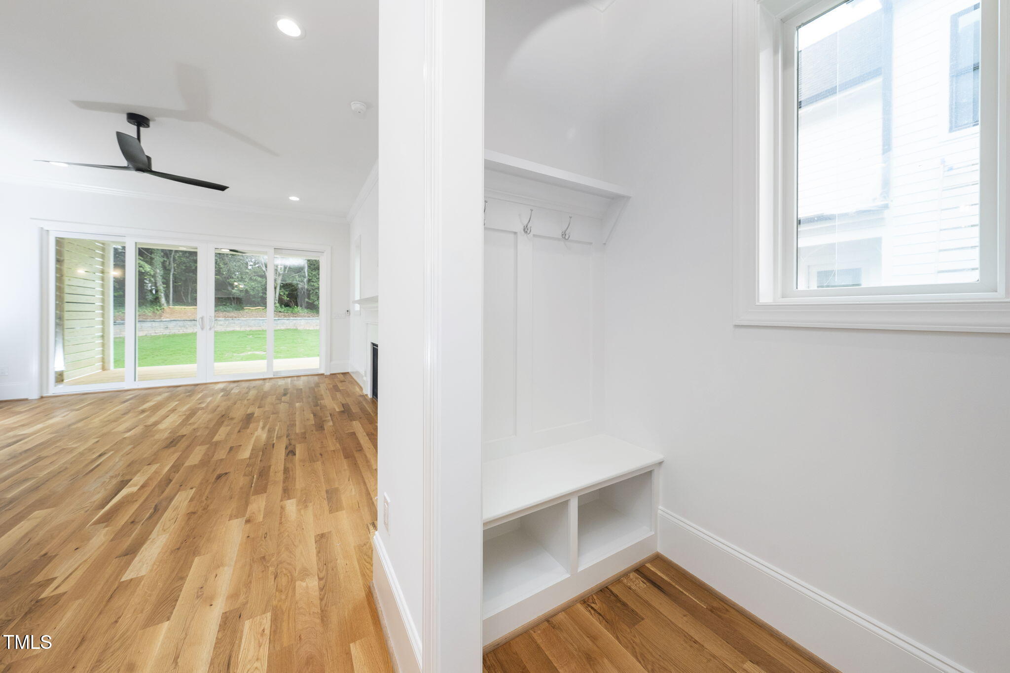 1332 Duplin Road Raleigh, NC 27607 - Photo 23 of 50 a view of empty room with wooden floor and fan