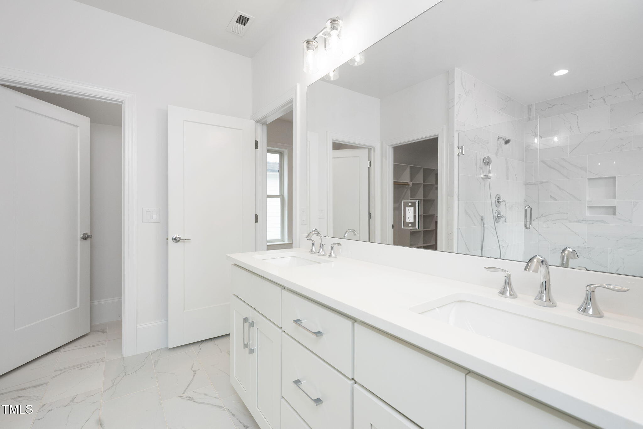 1332 Duplin Road Raleigh, NC 27607 - Photo 38 of 50 a bathroom with a sink and a mirror