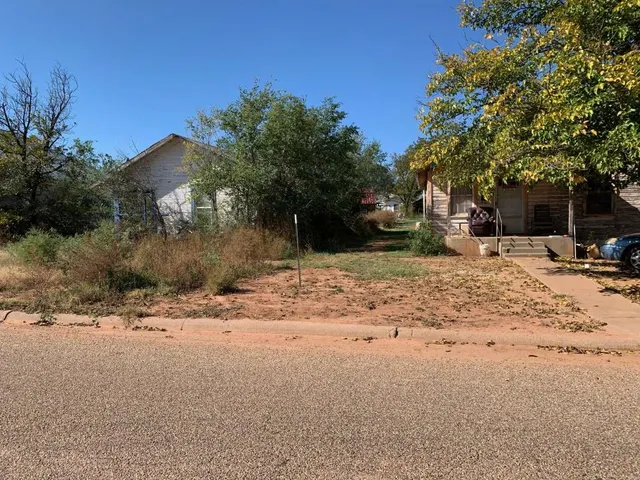 a view of a backyard of a house